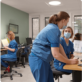 Medical staff talking in an office with circadian lighting